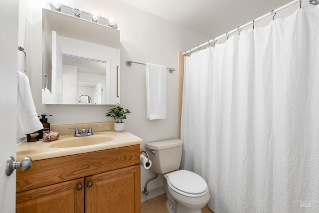 8305 W Rifleman St, Boise, ID 83704 - full bath with vanity, toilet, and tile patterned flooring