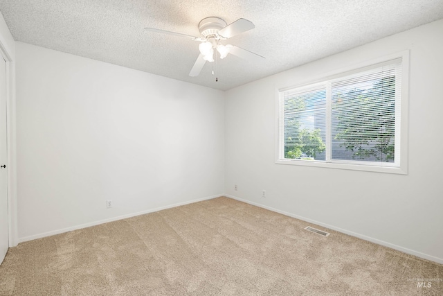 8305 W Rifleman St, Boise, ID 83704 - unfurnished room with a textured ceiling, light colored carpet, a ceiling fan, and baseboards