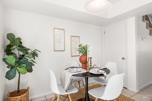 8305 W Rifleman St, Boise, ID 83704 - dining room featuring baseboards and light tile patterned floors