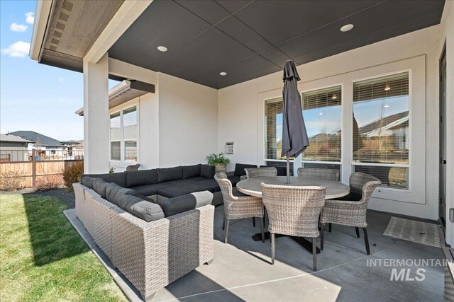 view of patio / terrace with fence, outdoor lounge area, and outdoor dining space