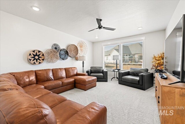 living area with a ceiling fan, carpet, a textured ceiling, and recessed lighting