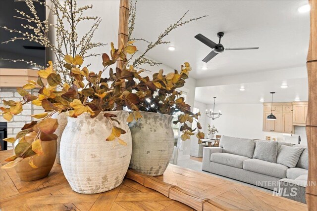 room details with ceiling fan with notable chandelier