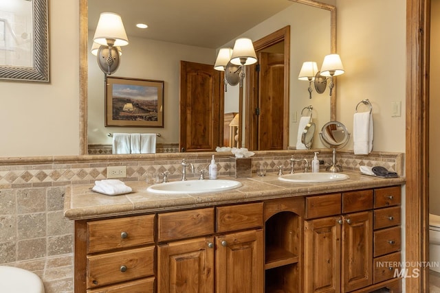 221 Picabo Street #D, Interest 1-H, Ketchum, ID 83340 - full bath with double vanity, toilet, and decorative backsplash