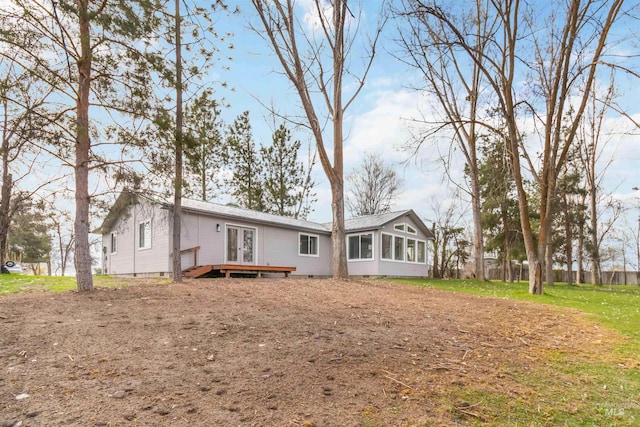 back of house featuring french doors, fence, and crawl space