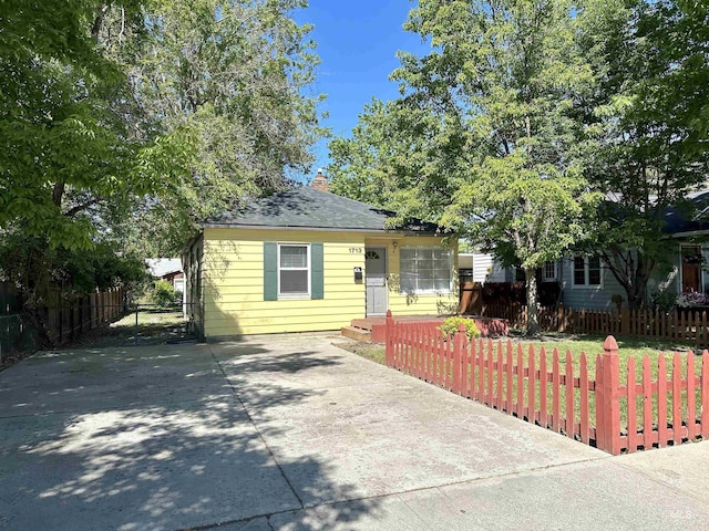 1713 S Euclid Ave, Boise, ID 83706 - view of front facade with concrete driveway and a chimney