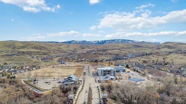 birds eye view of property with a mountain view