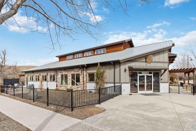 view of front of home with a patio, fence, a pergola, and french doors