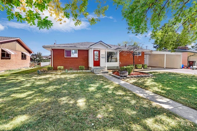 view of front of house with a garage and a front lawn