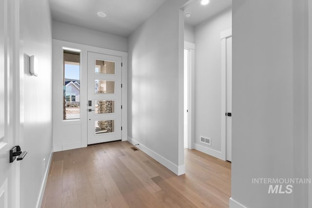 foyer with light wood-type flooring