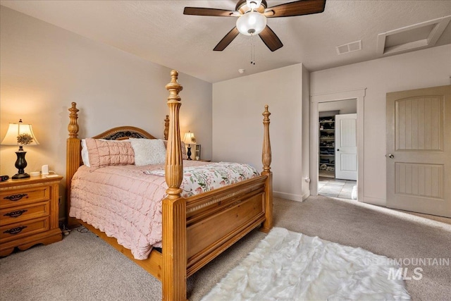 1063 Hitchcock St, Meridian, ID 83646 - bedroom featuring attic access, baseboards, visible vents, light colored carpet, and a ceiling fan