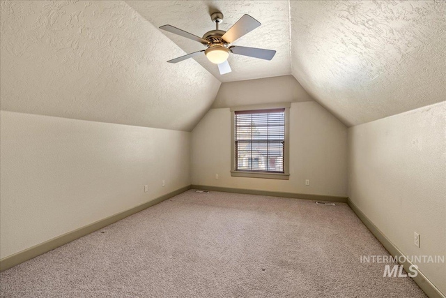 1063 Hitchcock St, Meridian, ID 83646 - bonus room with vaulted ceiling, carpet flooring, and a textured ceiling