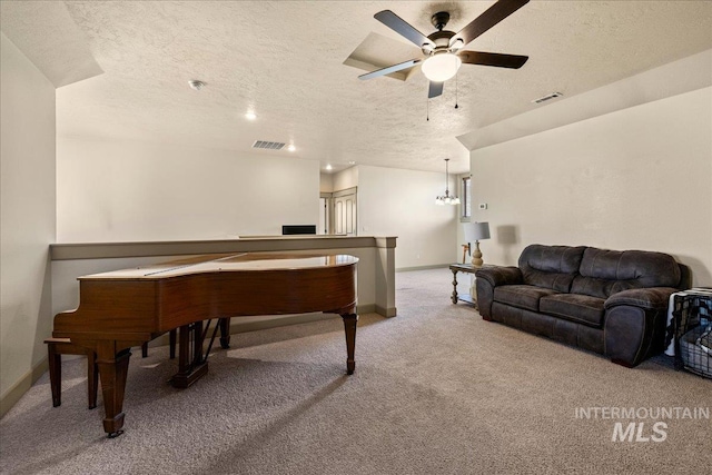 1063 Hitchcock St, Meridian, ID 83646 - rec room with a textured ceiling, baseboards, visible vents, and light colored carpet