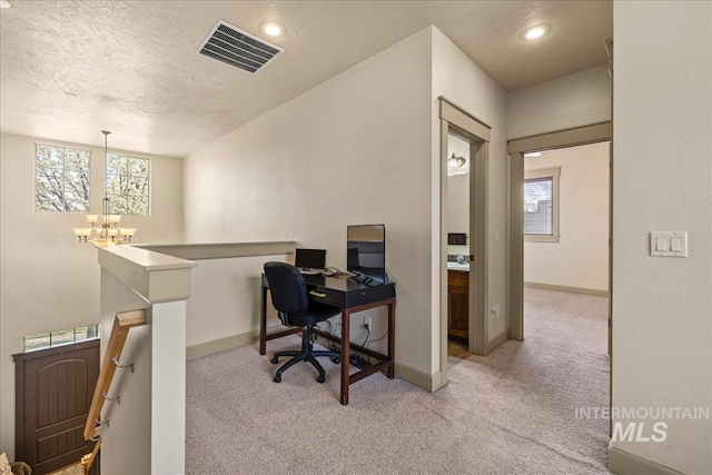 1063 Hitchcock St, Meridian, ID 83646 - office featuring visible vents, carpet floors, baseboards, a chandelier, and a textured ceiling