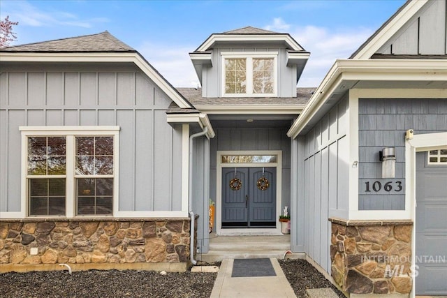 1063 Hitchcock St, Meridian, ID 83646 - entrance to property featuring board and batten siding, roof with shingles, and stone siding