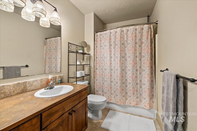 1063 Hitchcock St, Meridian, ID 83646 - bathroom with shower / bath combo, tile patterned floors, a textured ceiling, vanity, and toilet