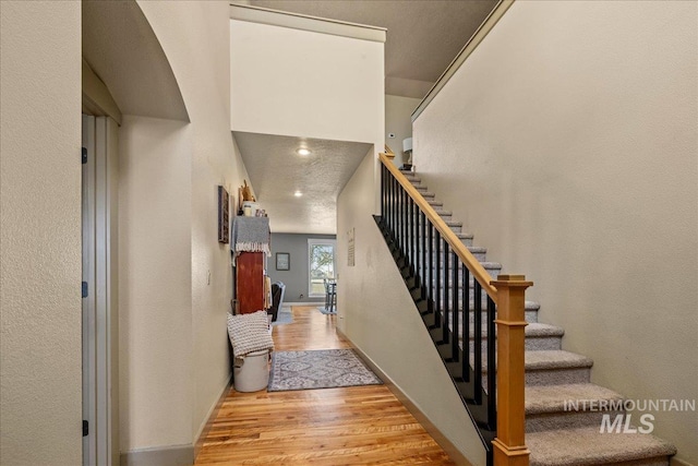 1063 Hitchcock St, Meridian, ID 83646 - stairway featuring wood finished floors and baseboards