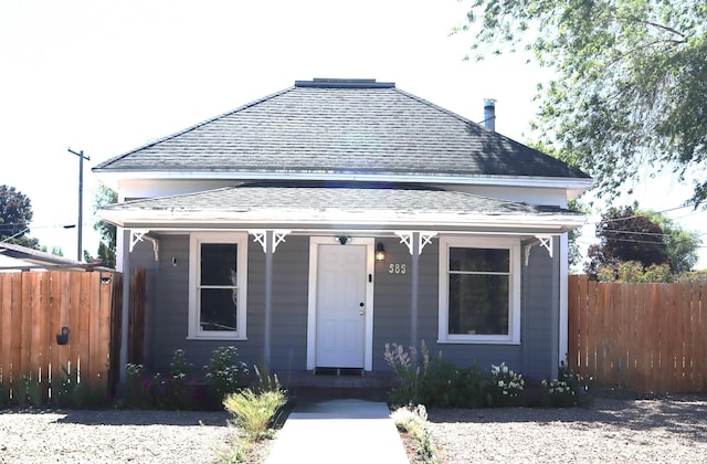 585 N 5th E, Mountain Home, ID 83647 - view of front facade with roof with shingles and a porch