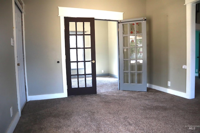 585 N 5th E, Mountain Home, ID 83647 - empty room featuring french doors, carpet, and baseboards