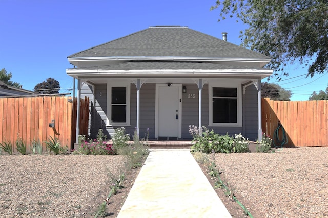 585 N 5th E, Mountain Home, ID 83647 - view of front of house with covered porch and a shingled roof