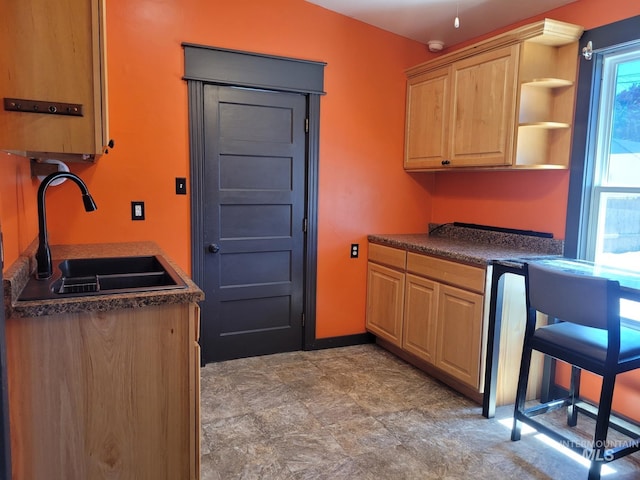 585 N 5th E, Mountain Home, ID 83647 - kitchen featuring a sink, dark countertops, light brown cabinetry, and open shelves