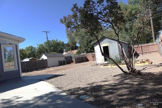 585 N 5th E, Mountain Home, ID 83647 - fenced backyard featuring a patio area