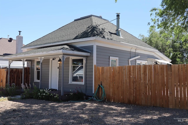 585 N 5th E, Mountain Home, ID 83647 - view of home's exterior featuring a porch and roof with shingles