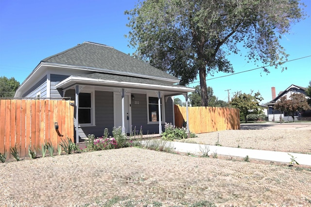 585 N 5th E, Mountain Home, ID 83647 - view of front of home featuring a porch and a shingled roof