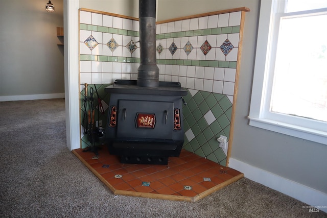 585 N 5th E, Mountain Home, ID 83647 - detailed view of a wood stove and carpet floors