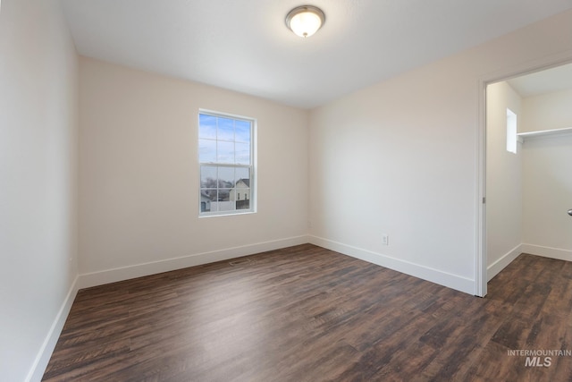 spare room featuring dark hardwood / wood-style floors