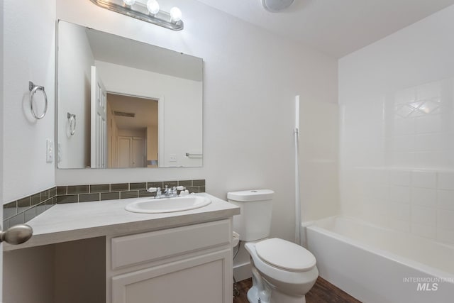 full bathroom with shower / tub combination, hardwood / wood-style flooring, vanity, and toilet