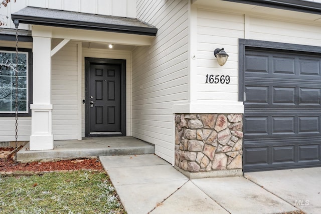 property entrance featuring a garage