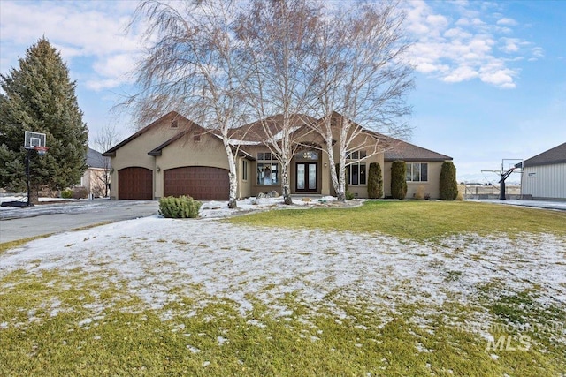 view of front facade with a front yard and a garage