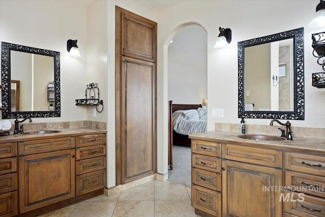 bathroom featuring tile patterned flooring and vanity