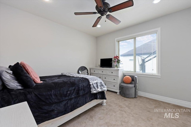 carpeted bedroom with ceiling fan