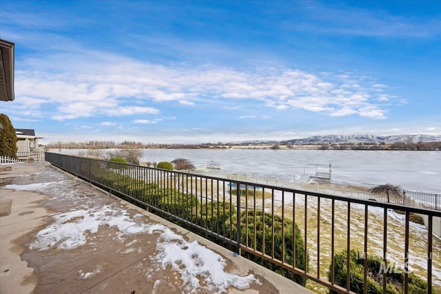 view of patio featuring a water view