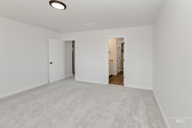 5813 W Stavros St, Meridian, ID 83646 - unfurnished bedroom with carpet, baseboards, and connected bathroom