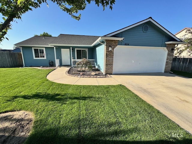 824 Manchester, Caldwell, ID 83605 - single story home featuring an attached garage, driveway, brick siding, and covered porch