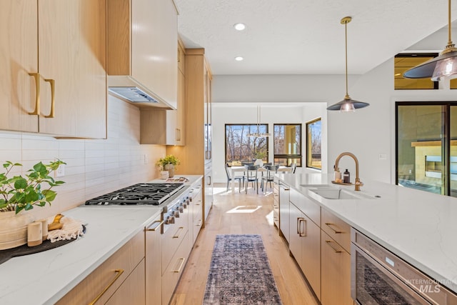 kitchen featuring pendant lighting, premium range hood, and light brown cabinets