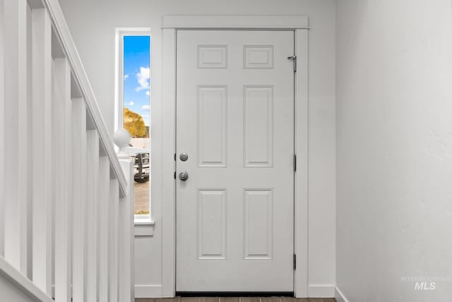 doorway to outside with hardwood / wood-style floors