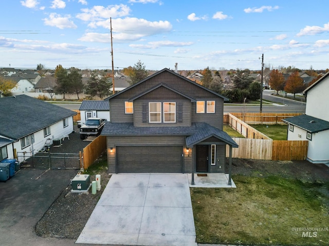 view of front facade featuring a garage and a front lawn