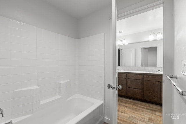 bathroom featuring vanity and wood-type flooring