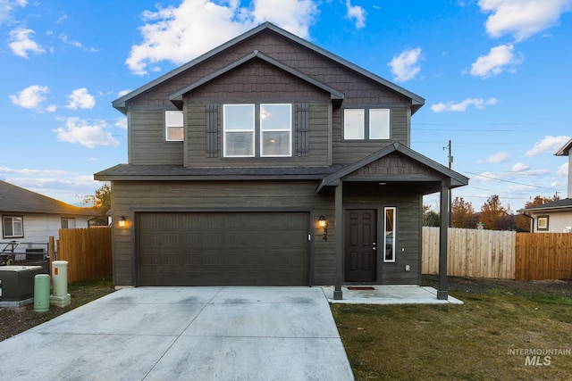 view of front of home featuring a front yard and a garage