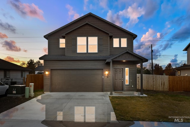 view of front property with a lawn and a garage