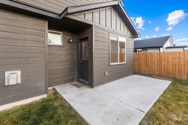 property entrance featuring a patio