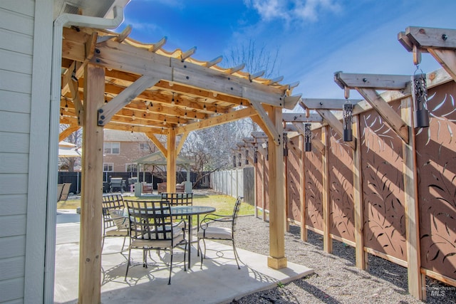 view of patio / terrace with a fenced backyard, outdoor dining area, and a pergola