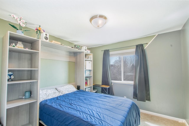 bedroom with carpet and baseboards