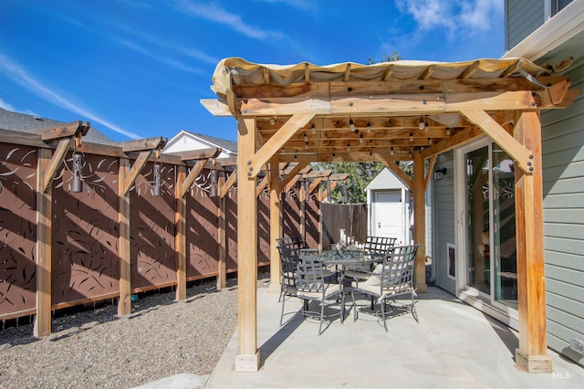 view of patio featuring outdoor dining area and a fenced backyard