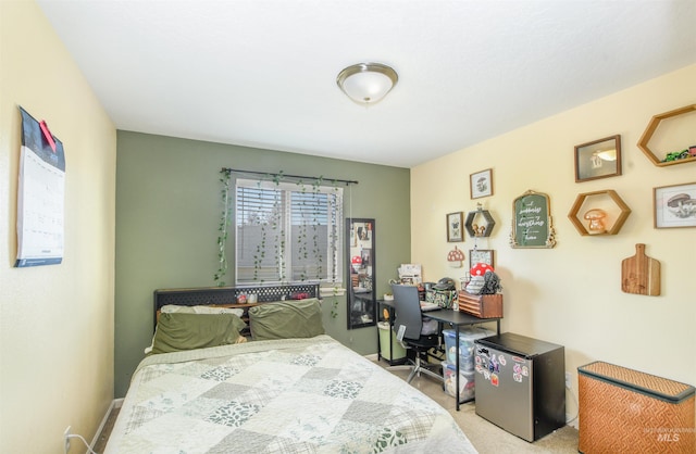 bedroom featuring carpet floors and fridge