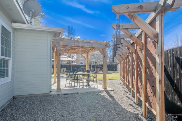 exterior space with a fenced backyard, a pergola, and a patio