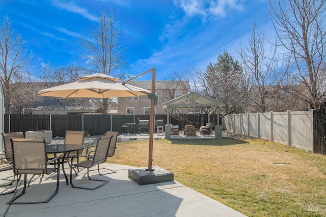 view of patio / terrace featuring a gazebo, outdoor dining space, and a fenced backyard